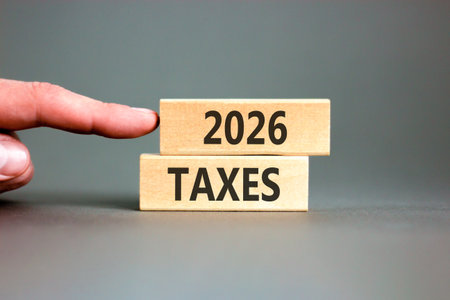 2026 taxes new year symbol. Concept words 2026 taxes on beautiful wooden blocks. Beautiful gray...