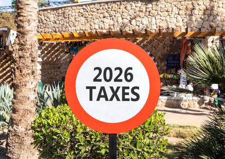 2026 taxes new year symbol. Concept words 2026 taxes on beautiful white and red road sign. Beautiful...