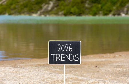 2026 Trends new year symbol. Concept words 2026 Trends on beautiful black blackboard. Beautiful mountain lake sand beach background. Business and 2026 Trends new year concept. Copy space.の写真素材