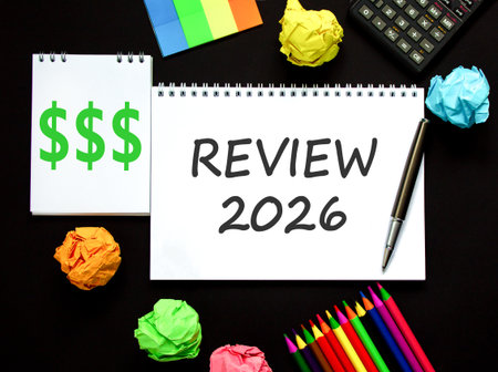 Review 2026 symbol. Concept words Review 2026 on beautiful white note. Beautiful black paper...