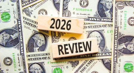 2026 Review symbol. Concept words 2026 Review on beautiful wooden blocks. Beautiful dollar bills...
