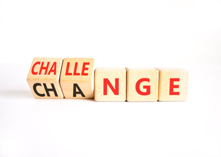 Chance or challenge symbol. Concept words Challenge to Chance on beautiful wooden cubes. Beautiful white table white background. Business challenge or chance concept. Copy space.の写真素材