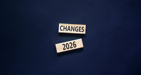 Changes 2026 symbol. Concept words Changes 2026 on beautiful wooden blocks. Beautiful black paper background. Business and changes 2026 concept. Copy space.の写真素材