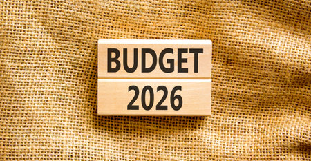 Budget 2026 symbol. Concept words Budget 2026 on beautiful wooden blocks. Beautiful canvas background. Business and budget 2026 concept. Copy space.の写真素材