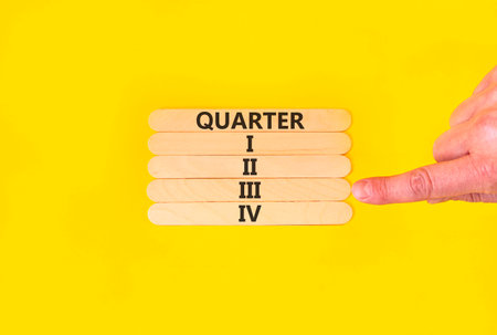 3rd third quarter 3 symbol. Concept word Quarter 3 on beautiful wooden sticks. Beautiful yellow...