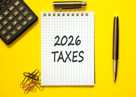 2026 taxes new year symbol. Concept words 2026 taxes on beautiful white note. Beautiful yellow background. Black pen. Beautiful black calculator. Business and 2026 taxes new year concept. Copy space.の写真素材
