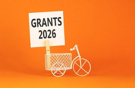 Grants 2026 symbol. Concept words Grants 2026 on beautiful white paper on wooden clothespin....