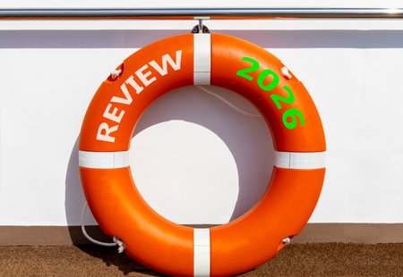 Review 2026 symbol. Concept words Review 2026 on beautiful orange lifebuoy. Beautiful white...