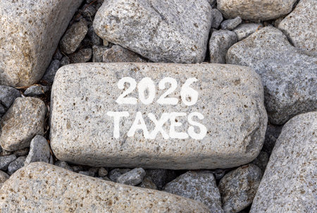 2026 taxes new year symbol. Concept words 2026 taxes on beautiful big gray stone. Beautiful gray stones background. Business and 2026 taxes new year concept. Copy space.の写真素材