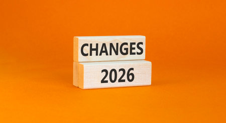 Changes 2026 symbol. Concept words Changes 2026 on beautiful wooden blocks. Beautiful orange paper...