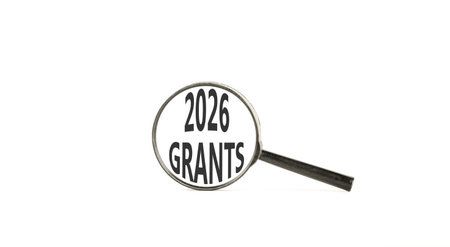 2026 Grants symbol. Concept words 2026 Grants on beautiful white paper. Black magnifying glass....