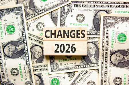 Changes 2026 symbol. Concept words Changes 2026 on beautiful wooden blocks. Beautiful dollar bills...
