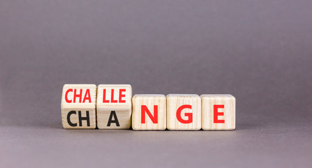 Chance or challenge symbol. Concept words Challenge to Chance on beautiful wooden cubes. Beautiful gray table gray background. Business challenge or chance concept. Copy space.の写真素材