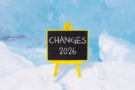 Changes 2026 symbol. Concept words Changes 2026 on beautiful black blackboard. Beautiful blue lake Baikal ice background. Business and changes 2026 concept. Copy space.の写真素材