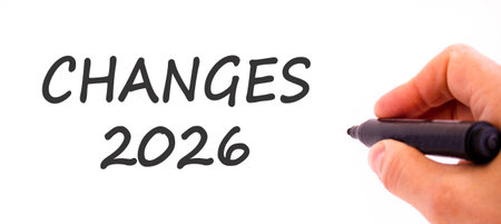 Changes 2026 symbol. Concept words Changes 2026 on beautiful white paper. Beautiful white paper background. Businessman's hand with pen. Business changes 2026 concept. Copy spaceの写真素材