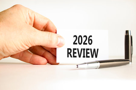 2026 Review symbol. Concept words 2026 Review on beautiful white card. Beautiful white paper...