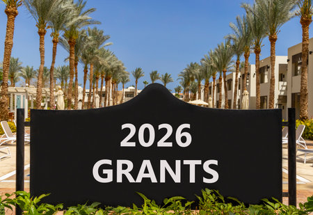 2026 Grants symbol. Concept words 2026 Grants on beautiful black road sign. Beautiful palm trees...