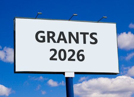 Grants 2026 symbol. Concept words Grants 2026 on beautiful big white billboard. Beautiful blue sky and clouds background. Business and grants 2026 concept. Copy space.の写真素材