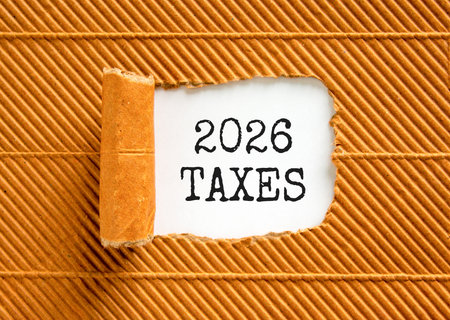 2026 taxes new year symbol. Concept words 2026 taxes on beautiful white paper. Beautiful brown paper background. Business and 2026 taxes new year concept. Copy space.の写真素材