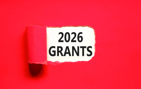 2026 Grants symbol. Concept words 2026 Grants on beautiful white paper. Beautiful red paper background. Business and 2026 grants concept. Copy space.の写真素材