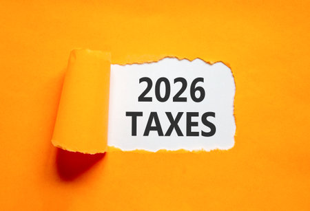 2026 taxes new year symbol. Concept words 2026 taxes on beautiful white paper. Beautiful orange paper background. Business and 2026 taxes new year concept. Copy space.の写真素材