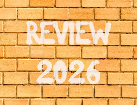 Review 2026 symbol. Concept words Review 2026 on beautiful old brown brick wall. Beautiful old brown brick wall background. Business and review 2026 concept. Copy space.の写真素材