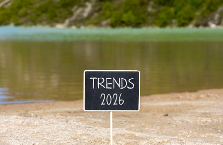 Trends 2026 new year symbol. Concept words Trends 2026 on beautiful black blackboard. Beautiful mountain lake sand beach background. Business and Trends 2026 new year concept. Copy space.の写真素材