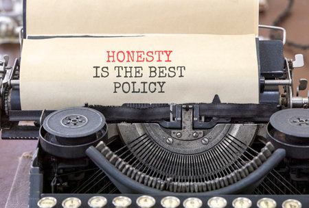Honesty is the best political symbol. Concept words Honesty is the best policy typed on beautiful old retro typewriter. Beautiful white background. Business honesty is the best policy concept. Copy spaceの写真素材
