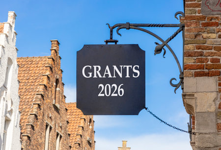 Grants 2026 symbol. Concept words Grants 2026 on beautiful black road sign. Beautiful street and...