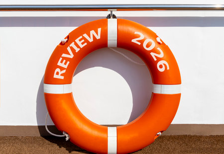 Review 2026 symbol. Concept words Review 2026 on beautiful orange lifebuoy. Beautiful white...