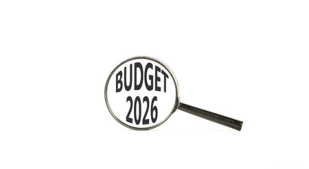 Budget 2026 symbol. Concept words Budget 2026 on beautiful white paper. Black magnifying glass....