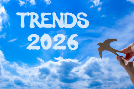 Trends 2026 new year symbol. Concept words Trends 2026 on beautiful blue sky. Beautiful blue sky background. Businessman's hand holds wooden bird. Business and Trends 2026 new year concept. Copy spaceの写真素材