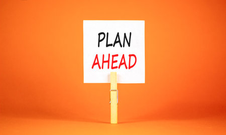 Plan ahead symbol. Concept word Plan ahead on beautiful white paper. Beautiful wooden clothespin....