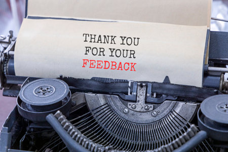 Thank you for your feedback symbol. Concept words Thank you for your feedback typed on old retro typewriter. Beautiful white paper background. Business thank you for your feedback concept. Copy space.の写真素材