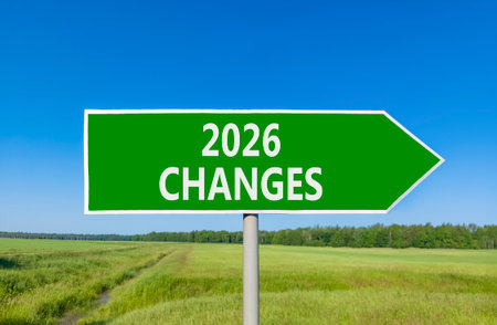 2026 Changes symbol. Concept words 2026 Changes on beautiful green road sign. Beautiful green grass field forest and blue sky background. Business and 2026 changes concept. Copy space.の写真素材