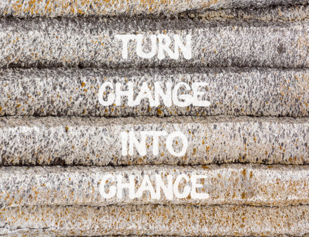 Turn change into chance symbol. Concept words phrase Turn change into chance on beautiful gray stone wall. Beautiful stone wall background. Business Turn change into chance concept. Copy space.の写真素材