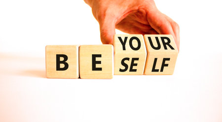Motivational be yourself symbol. Concept words Be yourself on beautiful wooden block. Beautiful white background Businessman hand. Business motivational be yourself concept. Copy space.の写真素材