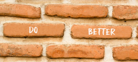 Do better symbol. Concept words Do better on beautiful brown brick wall. Beautiful brown brick wall background. Business and do better concept. Copy space.の写真素材