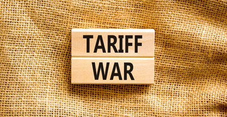 Trade tariff war symbol. Concept word Tariff war on beautiful wooden blocks. Beautiful canvas background. Business trade tariff wars concept. Copy space.の写真素材