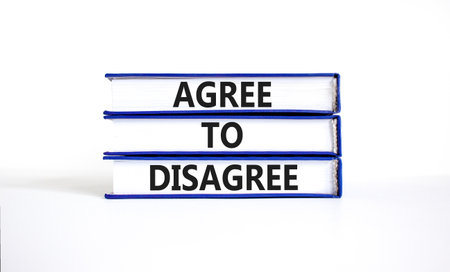 Agree to disagree symbol. Concept words Agree to disagree on beautiful books. Beautiful white paper background. Business and agree to disagree concept. Copy space.の写真素材