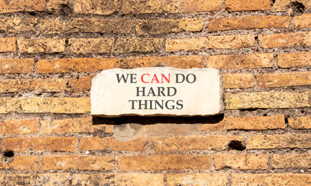 Support, help we can do hard things symbol. Concept words We can do hard things on beautiful marble sign plate. Beautiful brick wall background. Business we can do hard things concept. Copy space.の写真素材