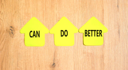 Can do better symbol. Concept words Can do better on beautiful yellow paper houses. Beautiful wooden background. Business and can do better concept. Copy space.の写真素材