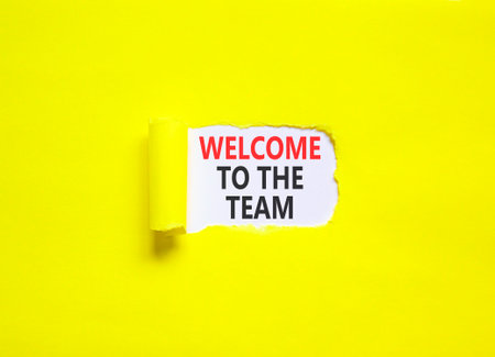 Support, help welcome to the team symbol. Concept words Welcome to the team on beautiful white paper. Beautiful yellow paper background. Business welcome to the team concept. Copy space.の写真素材
