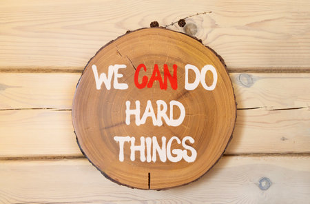 Support, help we can do hard things symbol. Concept words We can do hard things on beautiful wooden circle. Beautiful wooden wall background. Business we can do hard things concept. Copy space.の写真素材