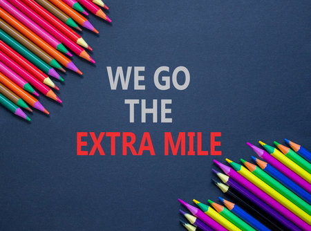 Support, help we go the extra mile symbol. Concept words We go the extra mile on beautiful gray...