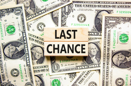Last chance symbol. Concept word Last chance on beautiful wooden blocks. Dollar bills. Beautiful dollar bills background. Business last chance concept. Copy space.の写真素材