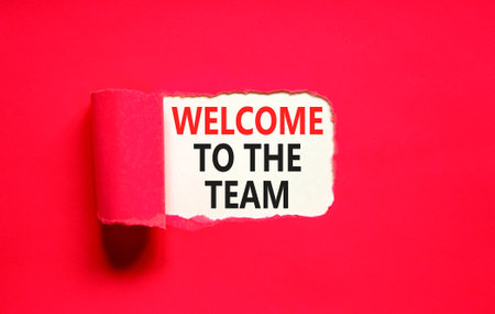 Support, help welcome to the team symbol. Concept words Welcome to the team on beautiful white paper. Beautiful red paper background. Business welcome to the team concept. Copy space.の写真素材