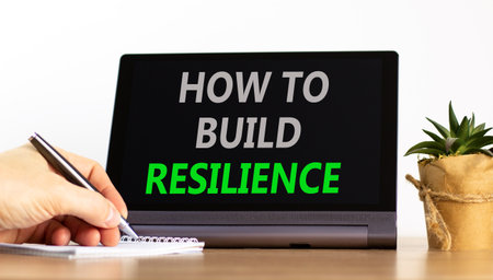 How to build resilience symbol. Concept words How to build resilience on beautiful black tablet. Beautiful white background. Businessman's hand. Business how to build resilience concept. Copy space.