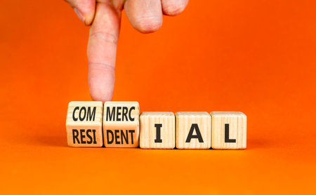 Commercial or residential symbol. Concept words Commercial or Residential on beautiful wooden...
