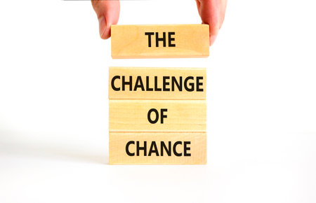 The challenge of chance symbol. Concept words phrase The challenge of chance on beautiful wooden blocks. Beautiful white paper background. Business The challenge of chance concept. Copy space.の写真素材